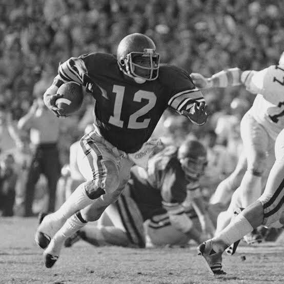 Charles White breaking through defenders