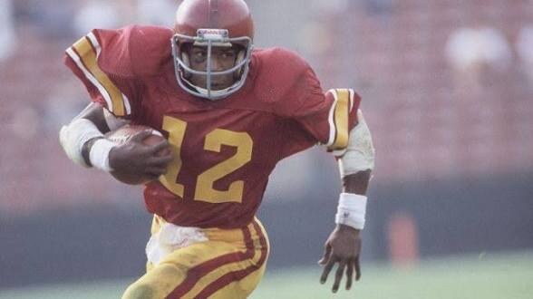Charles White carrying the football for USC